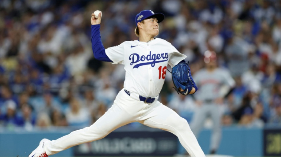 Dodgers down Reds to advance in MLB playoffs, Yankees stay alive