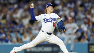 Dodgers down Reds to advance in MLB playoffs, Yankees stay alive