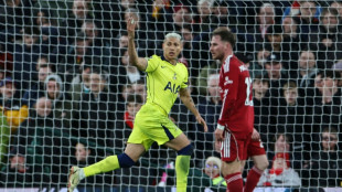 Spurs strike late to stun Liverpool, end losing streak