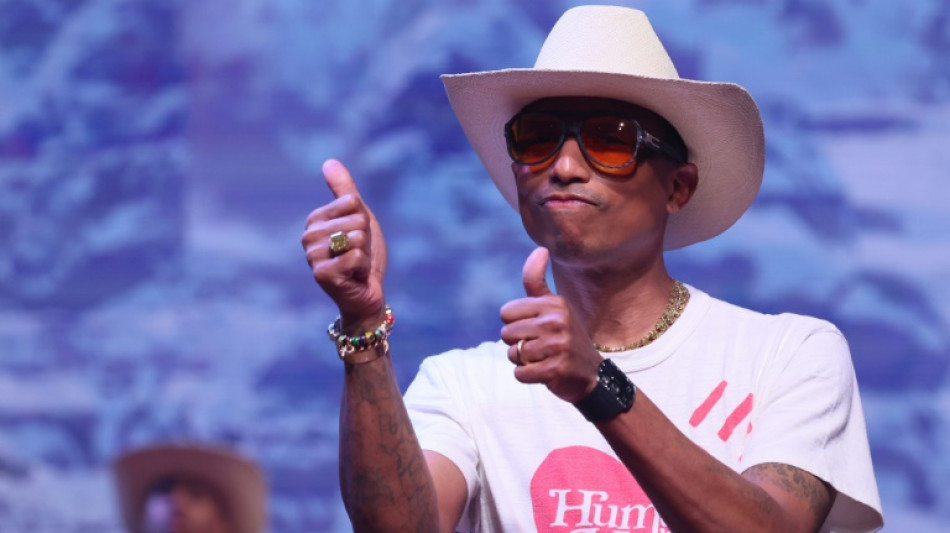 Pharrell bigs up brown denim as Paris fashion week starts