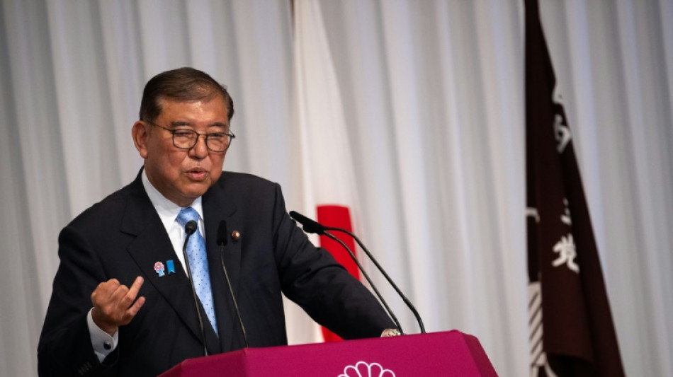 Japan PM hangs on after 'extremely regrettable'  election