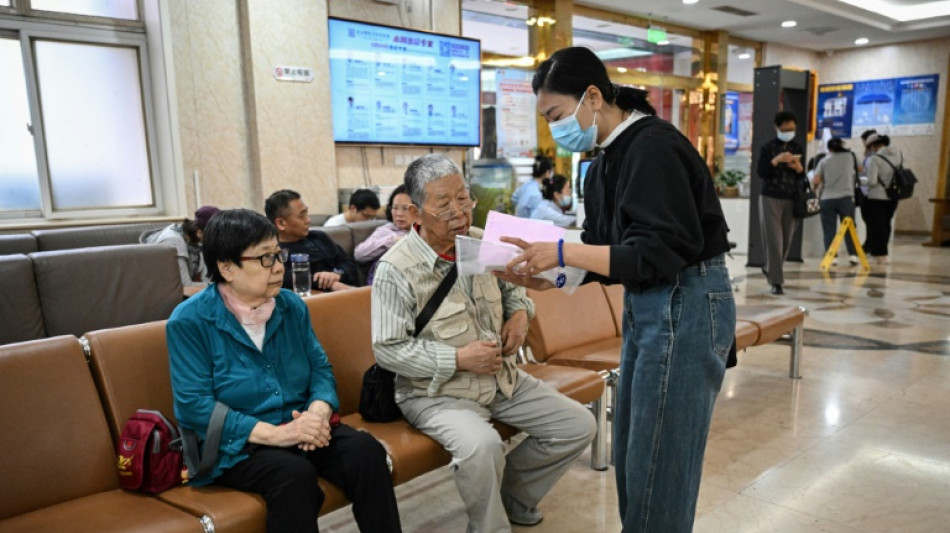 En Chine, des GPS humains pour naviguer dans le labyrinthe hospitalier