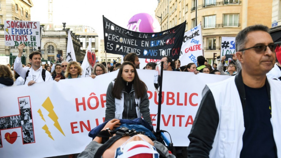 French hospital staff, relatives sue ministers over work-related suicides