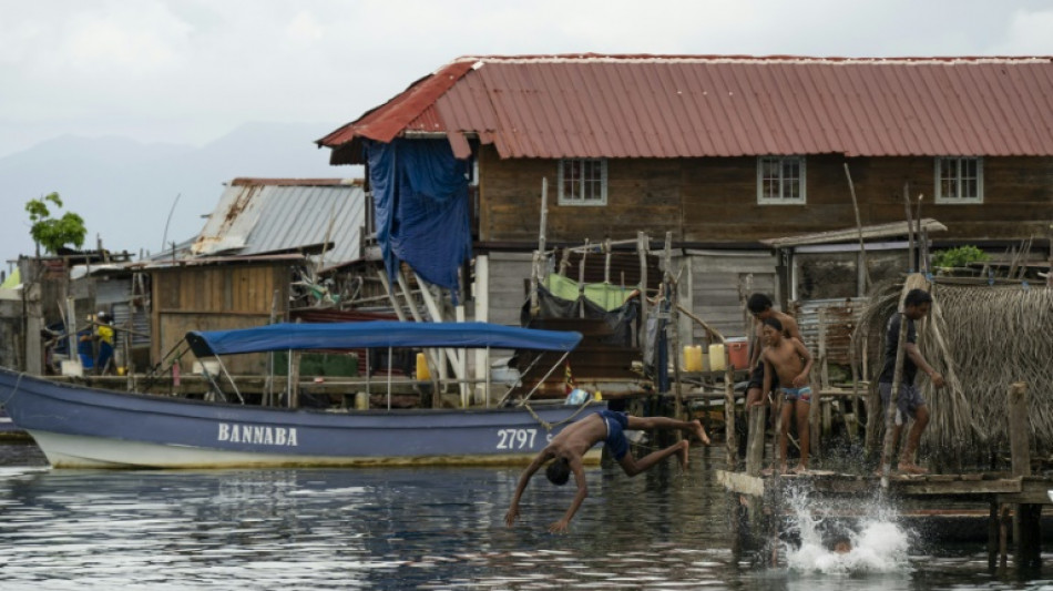 Year after exodus, silence fills Panama island threatened by sea