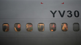 Migrants freed from El Salvador reach Venezuela in US prisoner deal