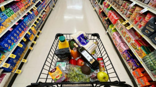 US indices power to fresh records after benign inflation data