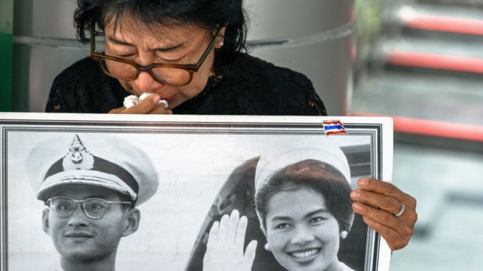 Black-clad Thai mourners weep for former Queen Sirikit