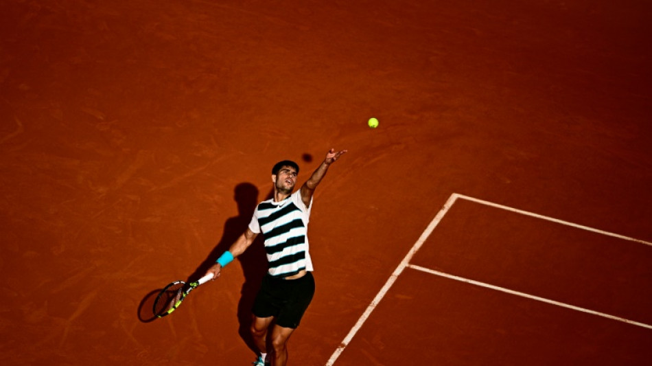 Alcaraz grinds past Shelton to reach Roland Garros last eight