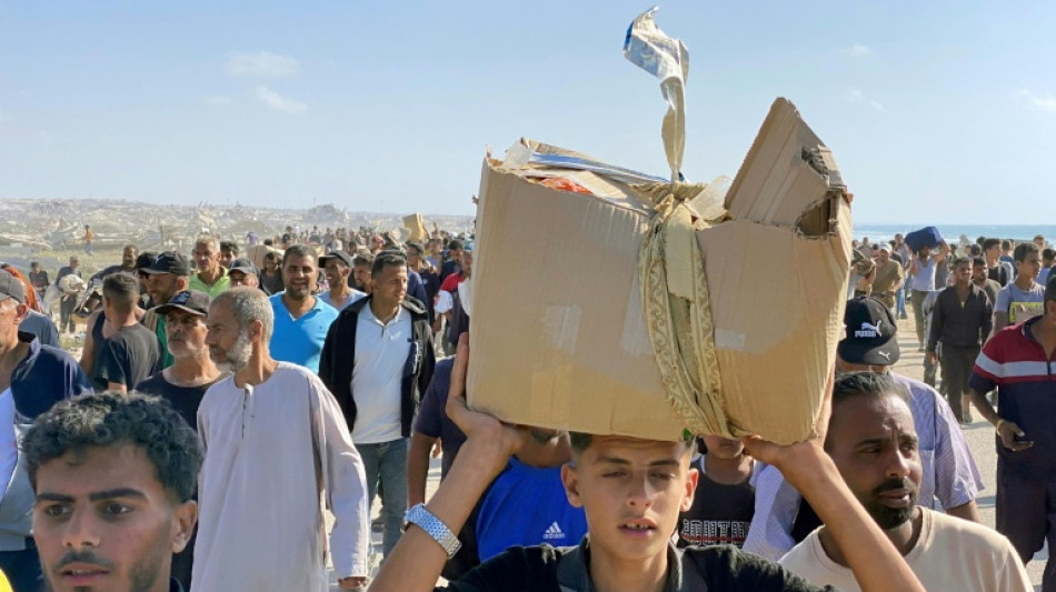 Tausende st&uuml;rmen Verteilzentrum von neuer Hilfsorganisation im Gazastreifen